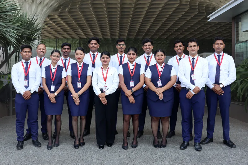 A batch in uniform under the canopy at Mumbai International Airport