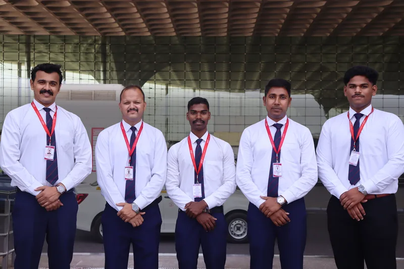 Five men in uniform at Mumbai International Airport