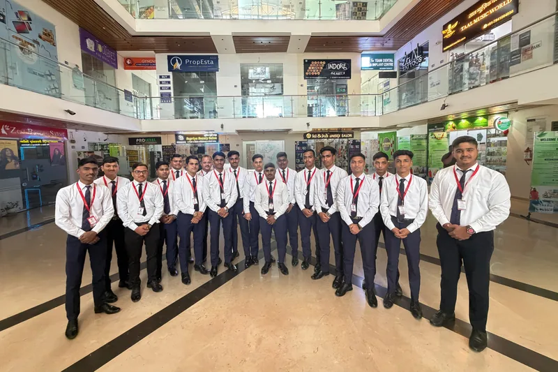A large group in uniform inside an airport terminal