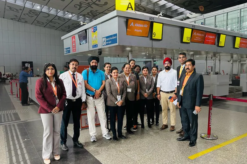 A group at the check-in counters of an airport