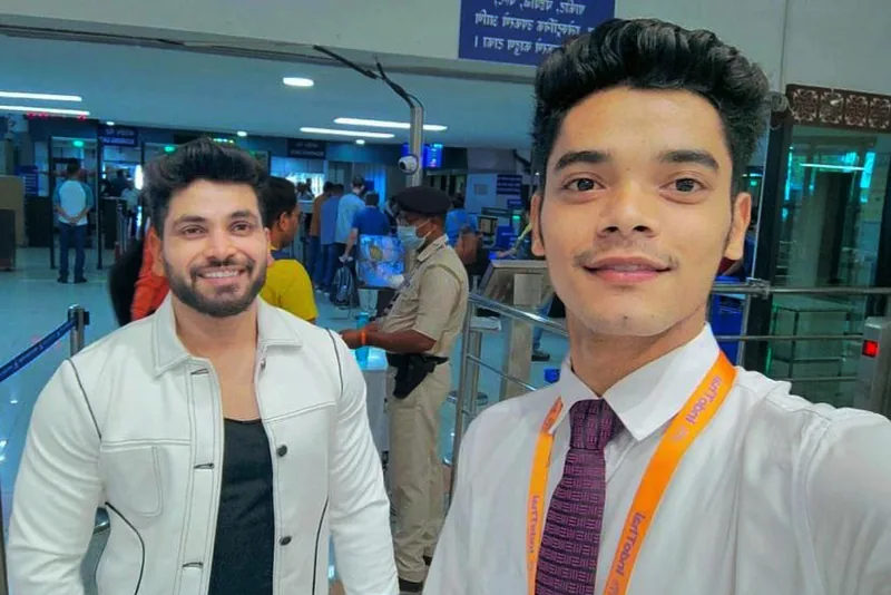 A trainee and a colleague at an airport terminal