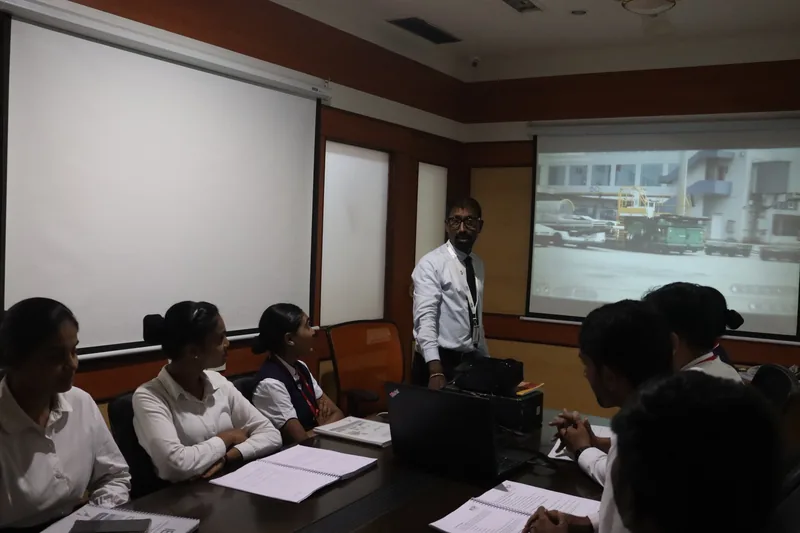 A trainer taking a class of IESP students in uniform at the Andheri East centre