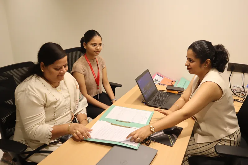 A counsellor going through a student's marksheet with them at an IESP centre
