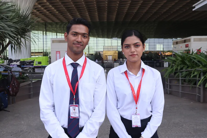 Two IESP students in uniform at Mumbai International Airport